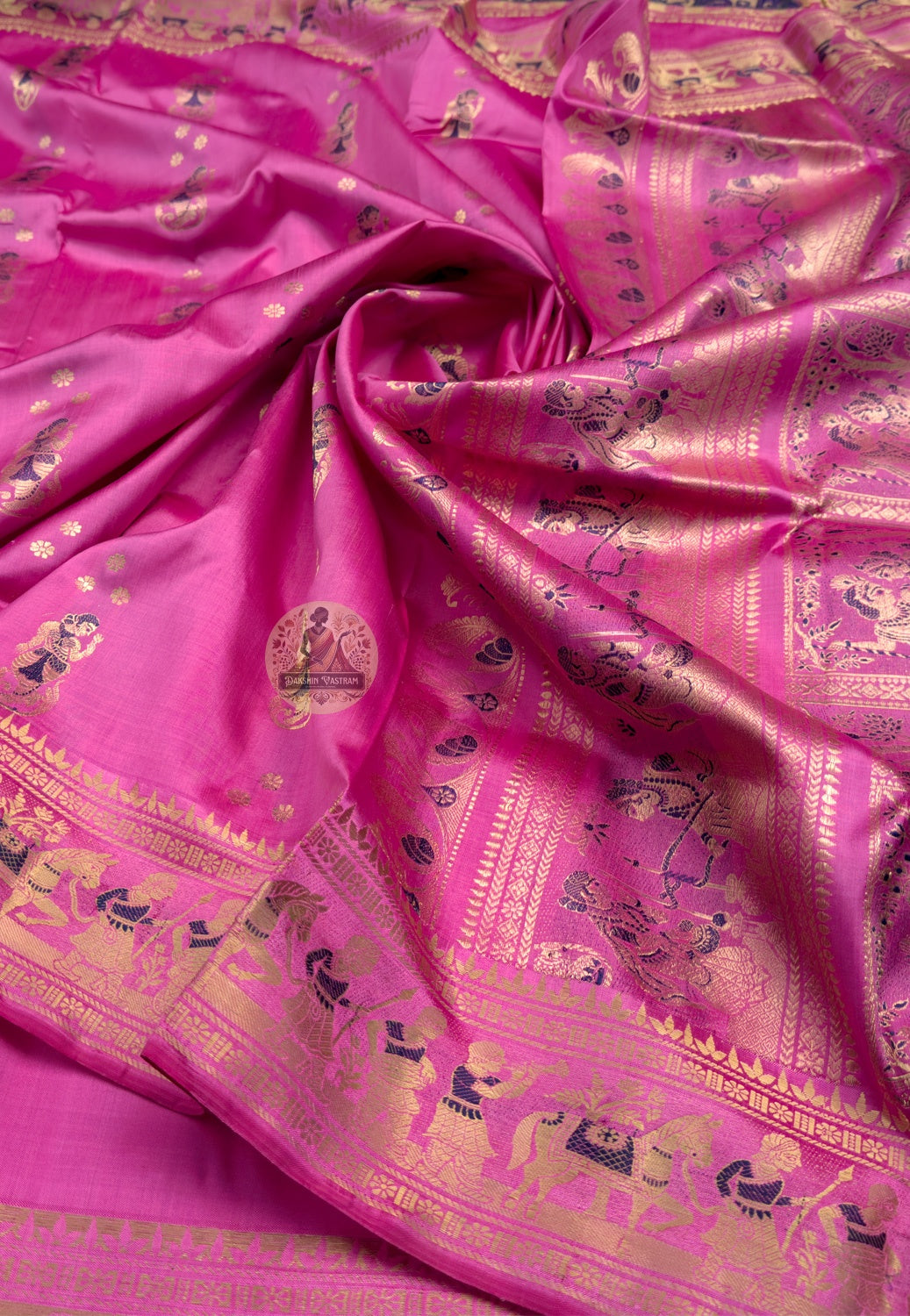 Close-up of Swarnachari silk saree pallu showing hand-woven golden zari weave with shifting light and Bengal temple-art motif detail, pit-loom West Bengal