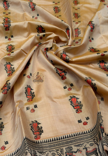 Close up of beige Baluchari silk saree pallu with figurative bands, red floral accents and paisley-shaped panels