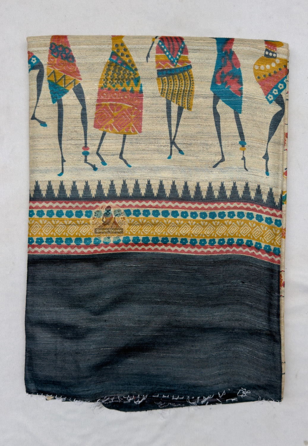 Close up of the pictorial pallu featuring colourful figures carrying vessels overhead and horizontal decorative bands