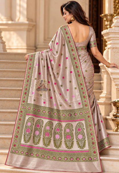 Close up of taupe Baluchari silk saree pallu with olive-toned paisley shapes and bright pink accents
