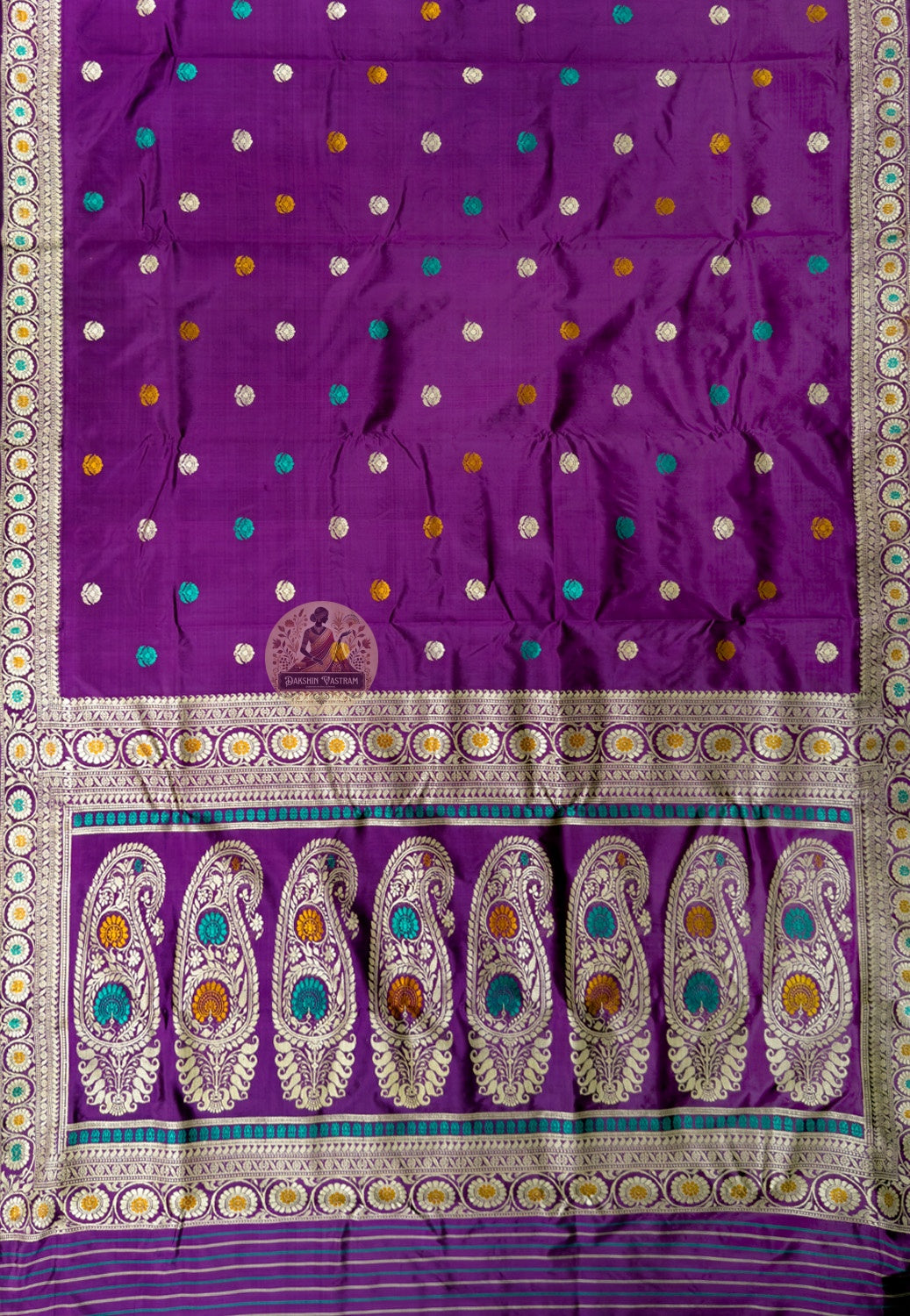 Close-up of Bishnupur Baluchari prestige silk saree weave showing master-woven mythological figures and ornate border formed thread by thread in pure silk