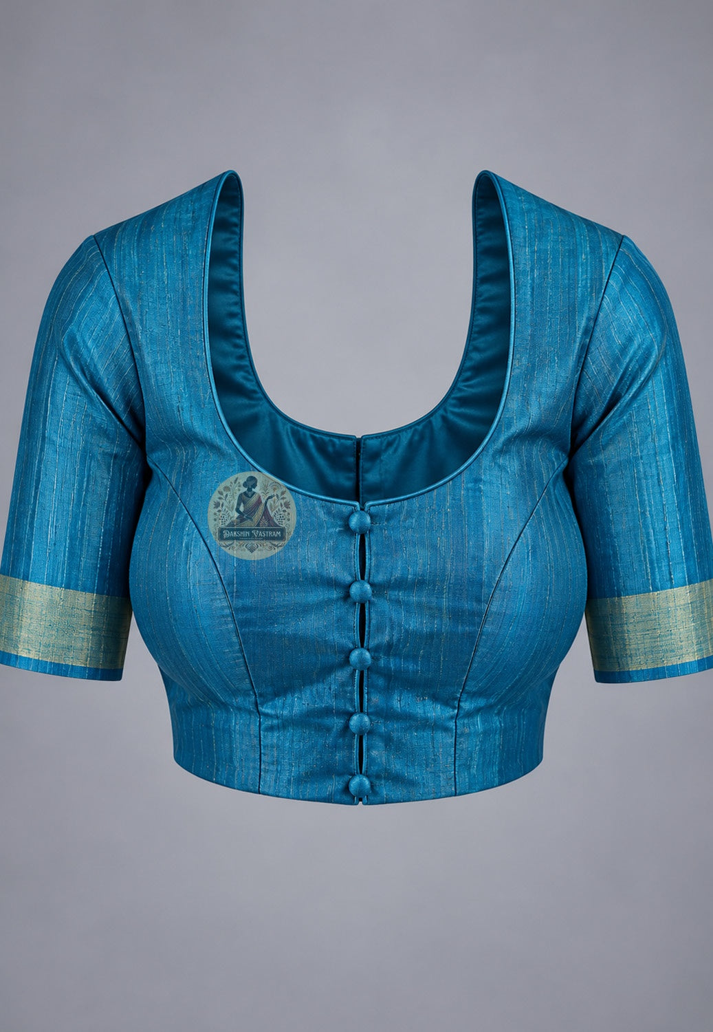 Blouse paired with green Ghicha Tussar silk saree in blue with contrasting sleeve edges