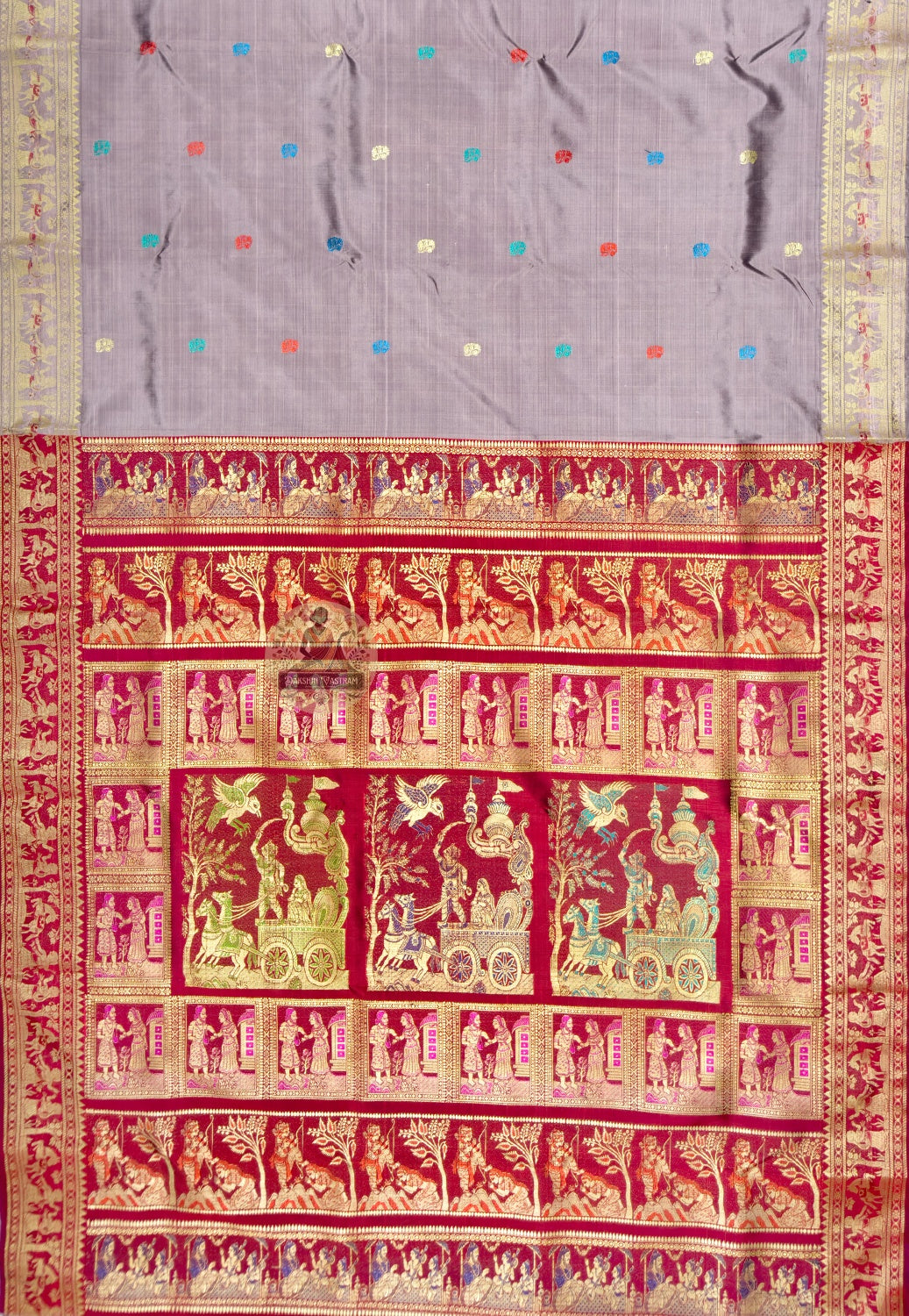 Close up of red, blue, green and pale motifs on the lavender-grey Baluchari silk saree body