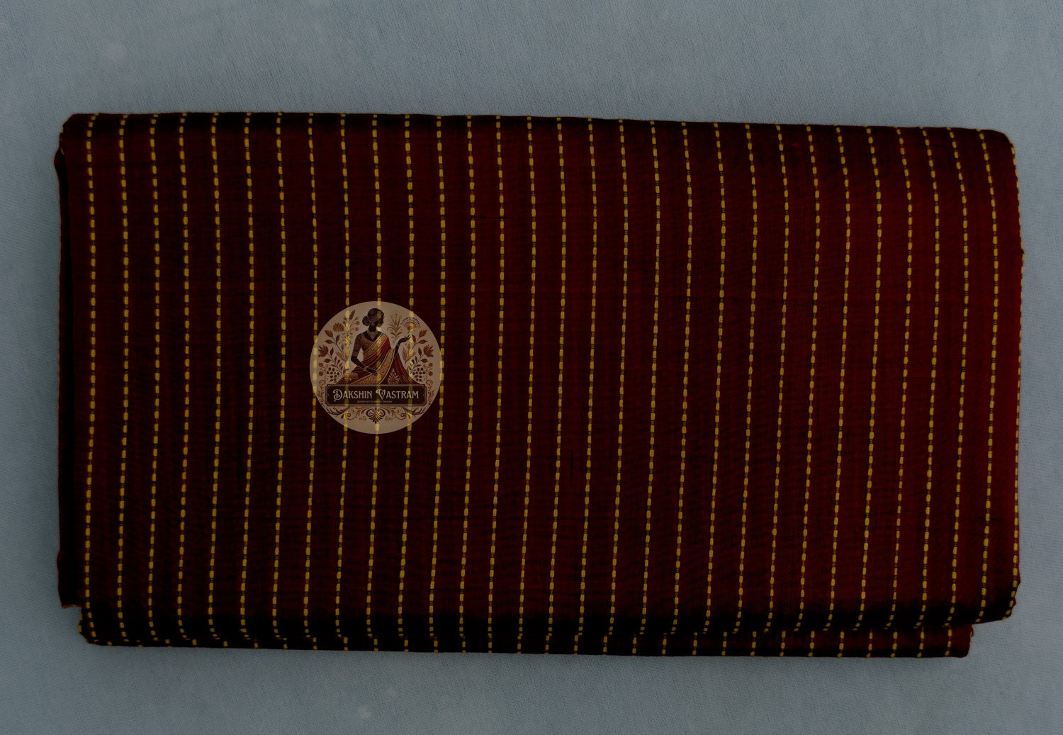 Detail view of Bishnupur Katan Silk Saree drape showing the structured fall and natural sheen of pure handwoven Katan silk with traditional Bengali motifs catching warm light
