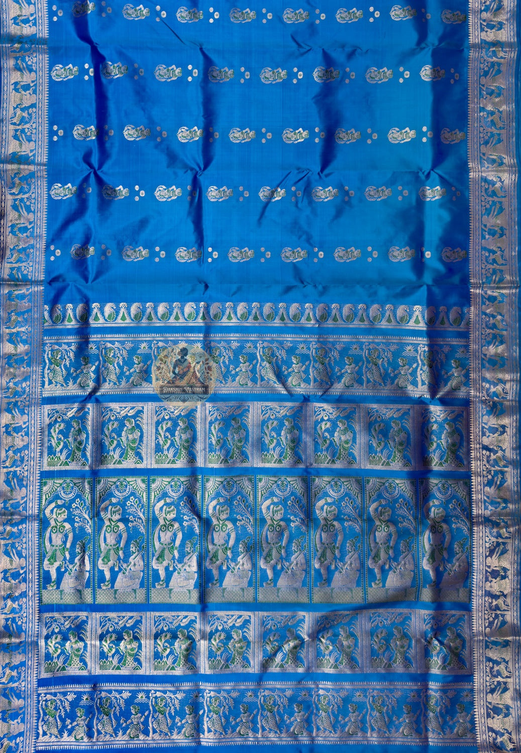 Full saree view of blue Swarnachari saree with repeating motifs and an ornate pallu