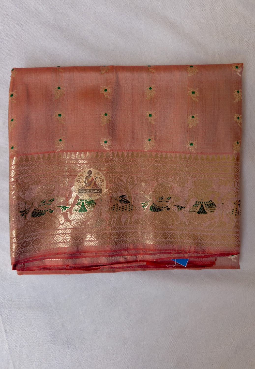 Full flat-lay of Swarnachari pure silk saree with golden zari identity border, Bengal soul narrative pallu, expressive buti field, and matching unstitched blouse piece, West Bengal handloom