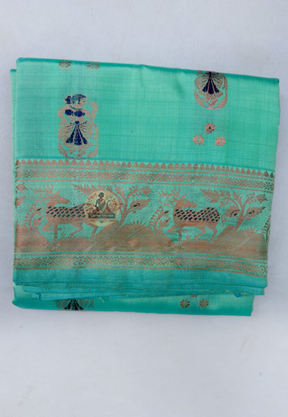 Close up of repeating motifs on the green Swarnachari silk saree body