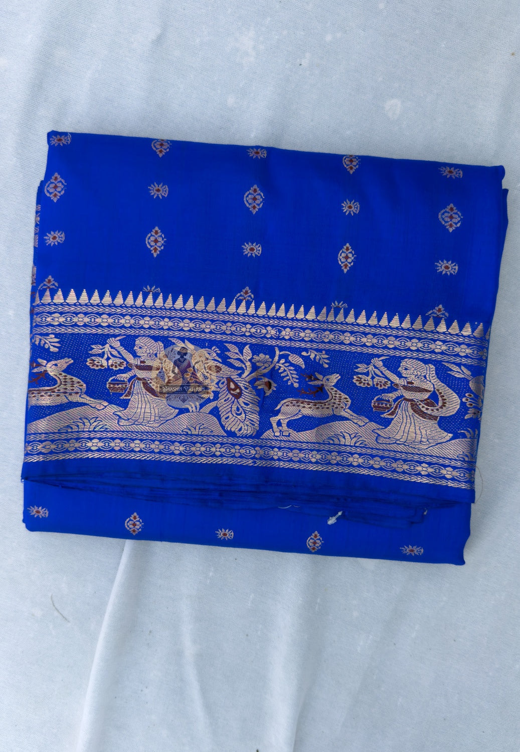 Full flat lay of Swarnachari handloom silk saree with golden zari border and pallu, six yards of Bengal heritage
