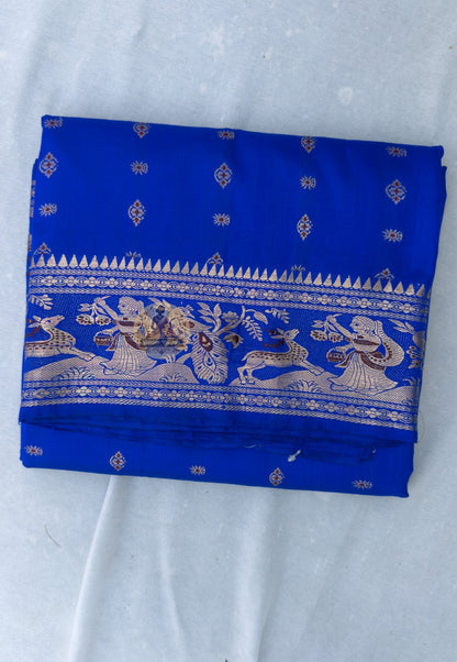 Full flat lay of Swarnachari handloom silk saree with golden zari border and pallu, six yards of Bengal heritage