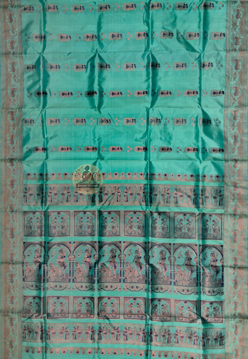 Full saree view of green Swarnachari silk saree with decorative borders and an elaborate pallu
