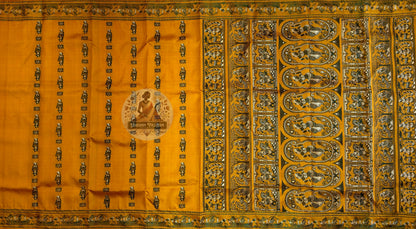 Flat lay of Baluchari silk saree body with scattered figurative motifs alongside the richly woven pallu featuring large oval medallions with mythological figures