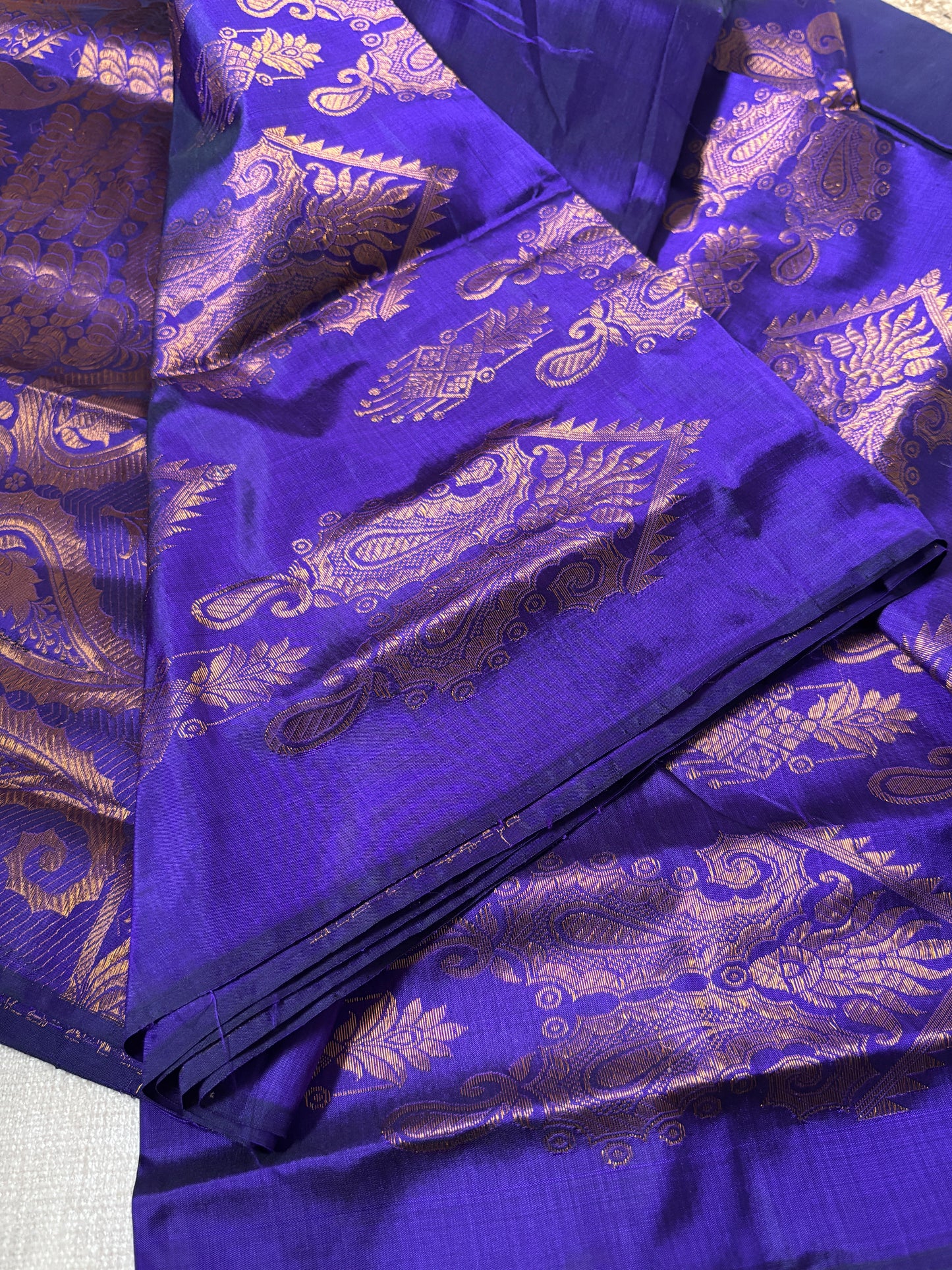 Rear view of Paat Mekhela Chador displaying chador drape with peacock lotus border and rang-dhang stripe body Sualkuchi Assam handloom