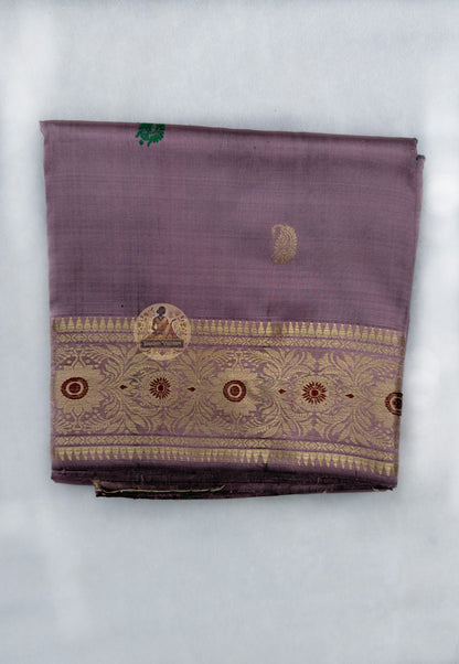  Full flat-lay of Swarnachari pure silk saree with golden zari declaration border, soul-stated pallu, identity buti field, and matching unstitched blouse piece, West Bengal handloom