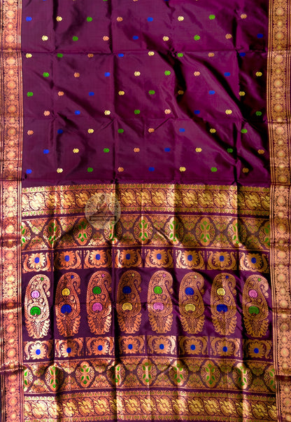 Close-up of premium Swarnachari silk saree pallu showing illuminating hand-woven golden zari panel with Bengal royal court figures in motion and temple composition revealed with depth and clarity