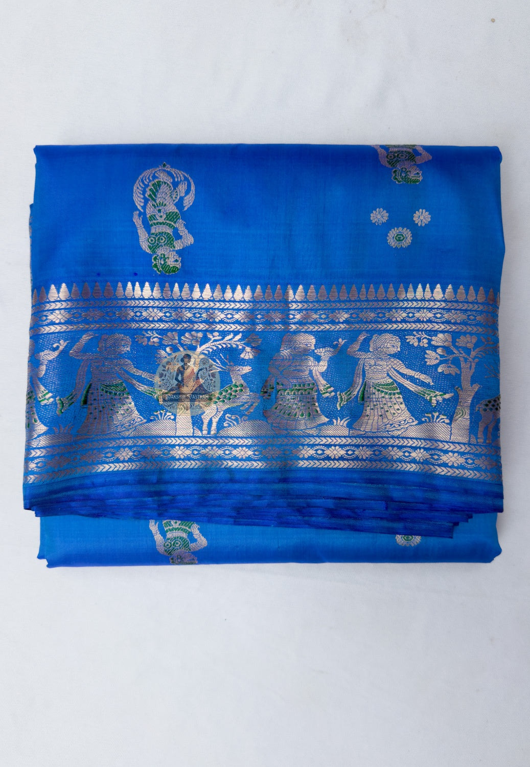 Full saree view highlighting the blue body, patterned borders and figurative pallu