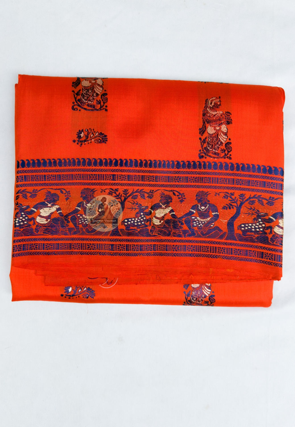 Side view of orange Baluchari silk saree showing the drape and patterned border