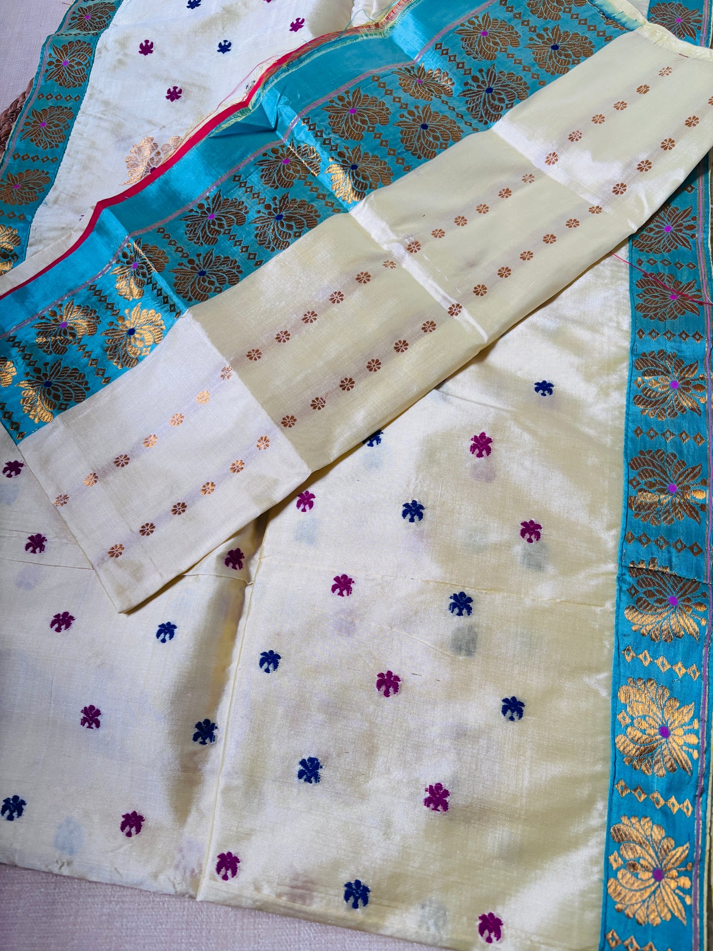 Front view of Paat Mekhela Chador with supplementary weft fish bamboo border and deep indigo warp stripe body authentic Sualkuchi Assam silk
