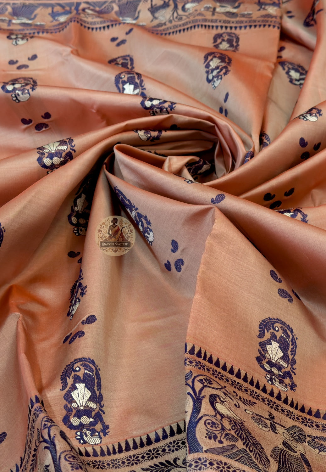 Detailed close-up of hand-woven border on Copper Peach Baluchari Silk Saree with traditional Bishnupur weave patterns and fine silk threads