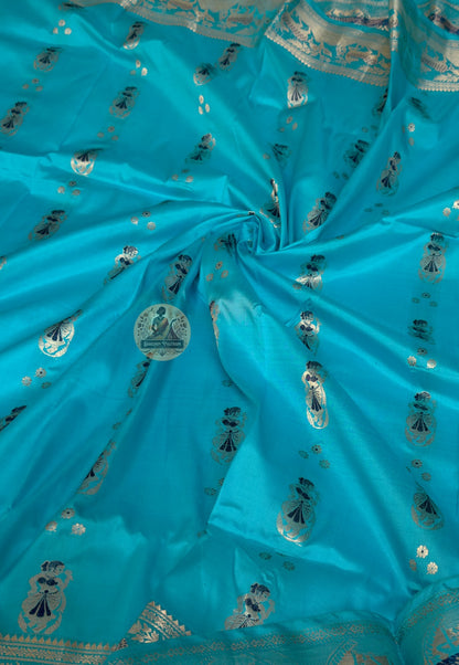 Close-up of Swarnachari handloom silk saree body showing warm pure silk ground with hand-thrown shuttle texture and fine golden zari butis (small woven motifs) in rhythmic spacing