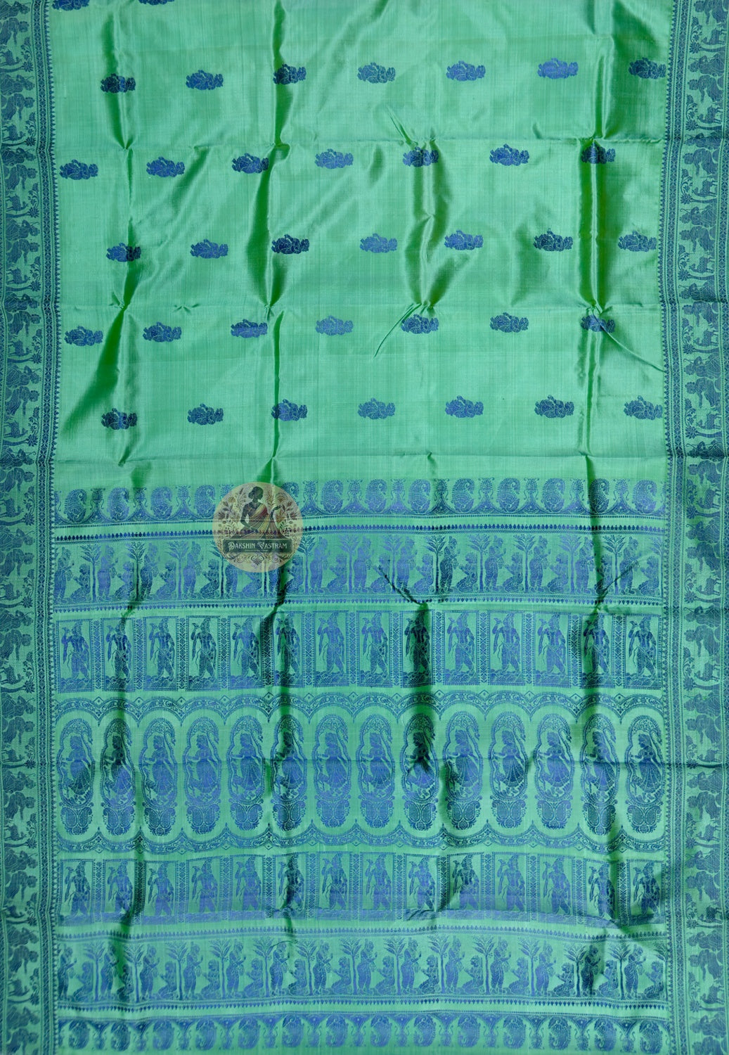 Full saree view of green Baluchari silk with blue borders and an elaborate figurative pallu