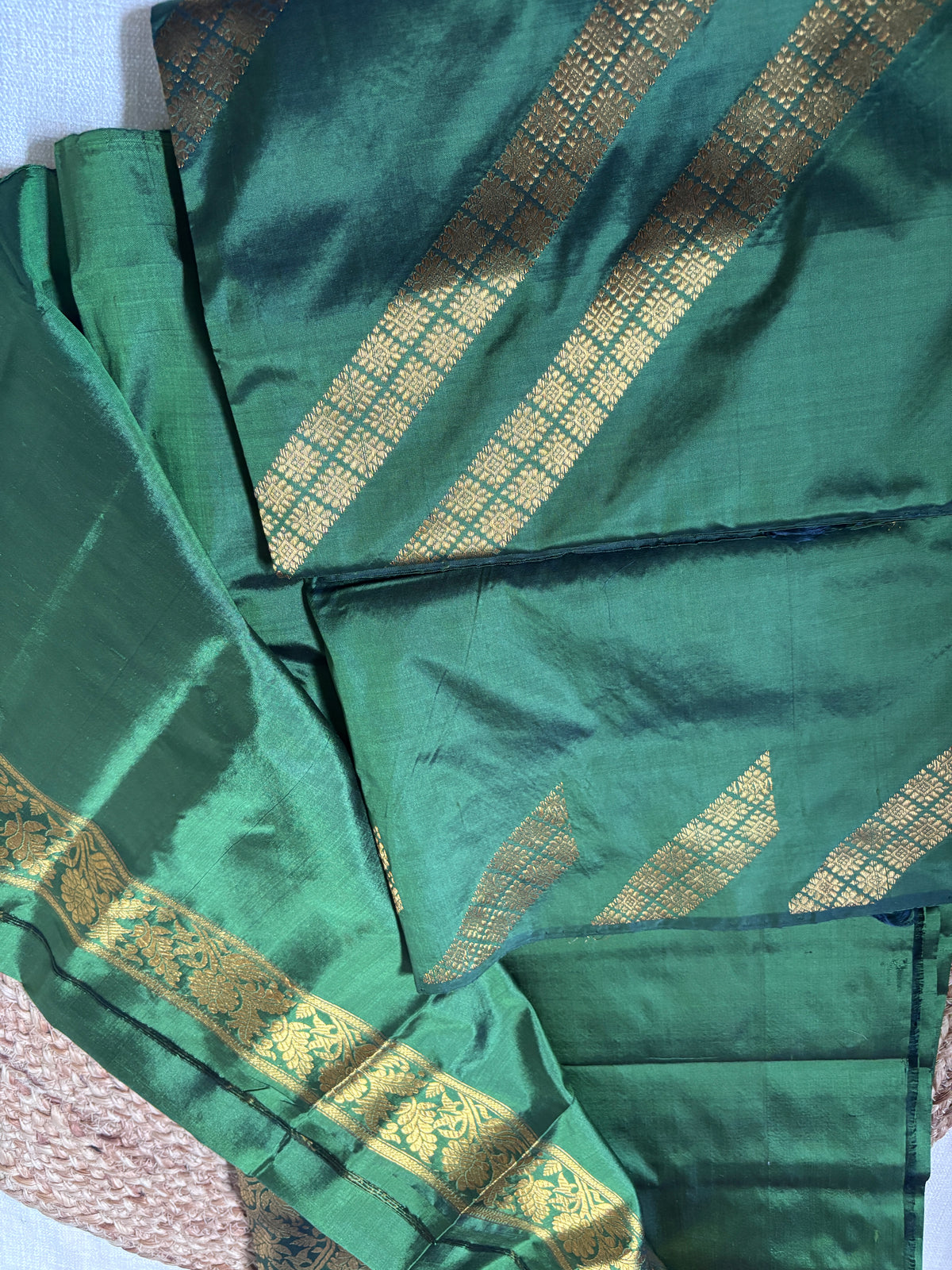 Close-up of handwoven kingkhap-inspired geometric diamond border detail on Paat Mekhela Chador authentic Assam mulberry silk craft