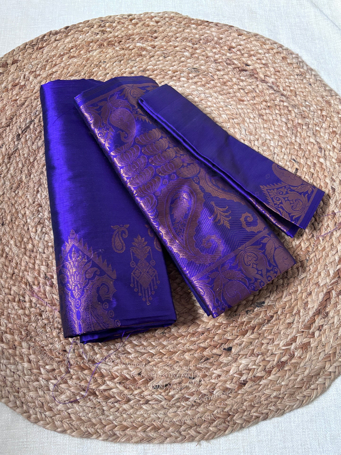 Front view of Paat Mekhela Chador with handwoven peacock lotus pond border and rang-dhang diagonal stripe body authentic Sualkuchi Assam silk