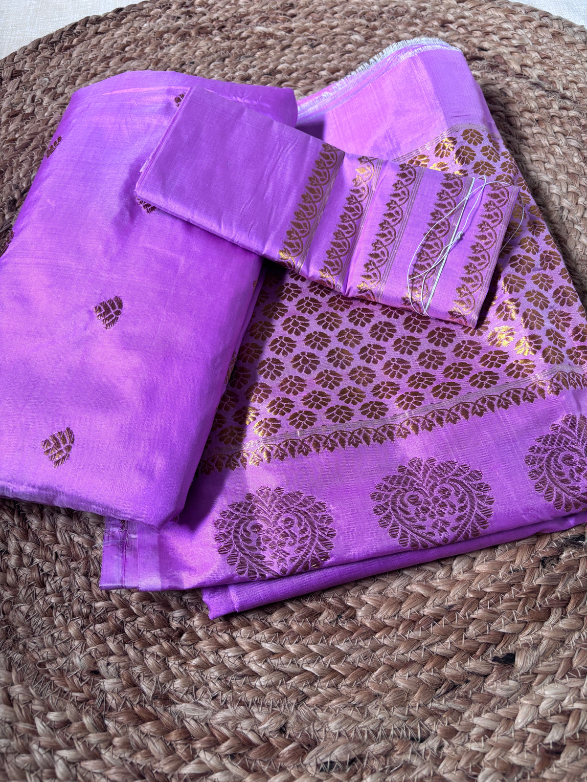 Side view of Paat Mekhela Chador showing bridal reception drape and swan pair handloom border authentic Sualkuchi Assam mulberry silk