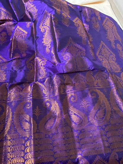 Close-up of handwoven peacock mayur and lotus pond border detail on Paat Mekhela Chador authentic Sualkuchi Assam mulberry silk craft