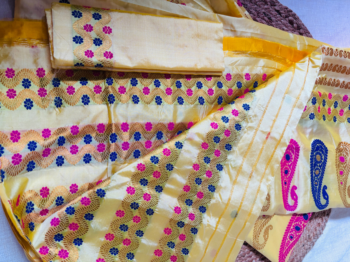 Front view of Paat Mekhela Chador with handwoven tortoise kashyap and water hyacinth border woven grid body authentic Sualkuchi Assam silk
