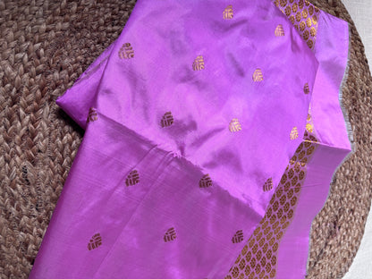 Rear view of Paat Mekhela Chador displaying chador drape with paired swan hans border and gamosa checkered body Sualkuchi Assam handloom