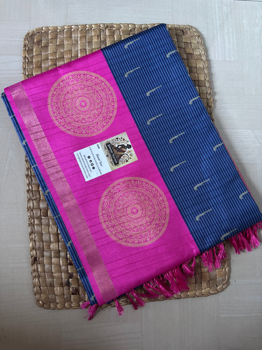 Pink and blue saree with decorative patterns on a woven tray