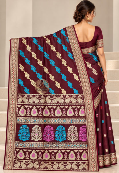Side view of wine Baluchari silk saree showing lustrous folds and a pale circular-medallion border
