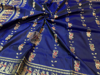 Full flat-lay view of Baluchari Pure Silk Saree showing complete handwoven silk body with Baluchari buti, traditional motif border, and richly illustrated narrative pallu — part of Durga Puja 2026 Collection, a tradition that refused to disappear