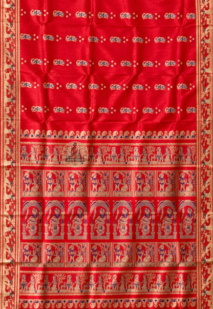 Rear view of Swarnachari silk saree showcasing fully expressed pallu with Ramayana Mahabharata and Bishnupur temple art golden zari motifs visible and readable from across the room