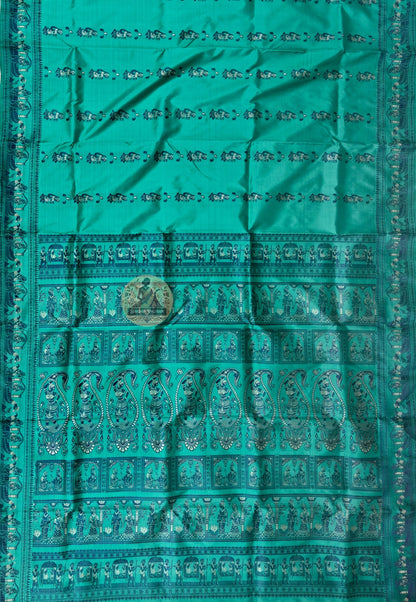 Full saree view of green Baluchari silk saree with decorative borders and an elaborate pallu