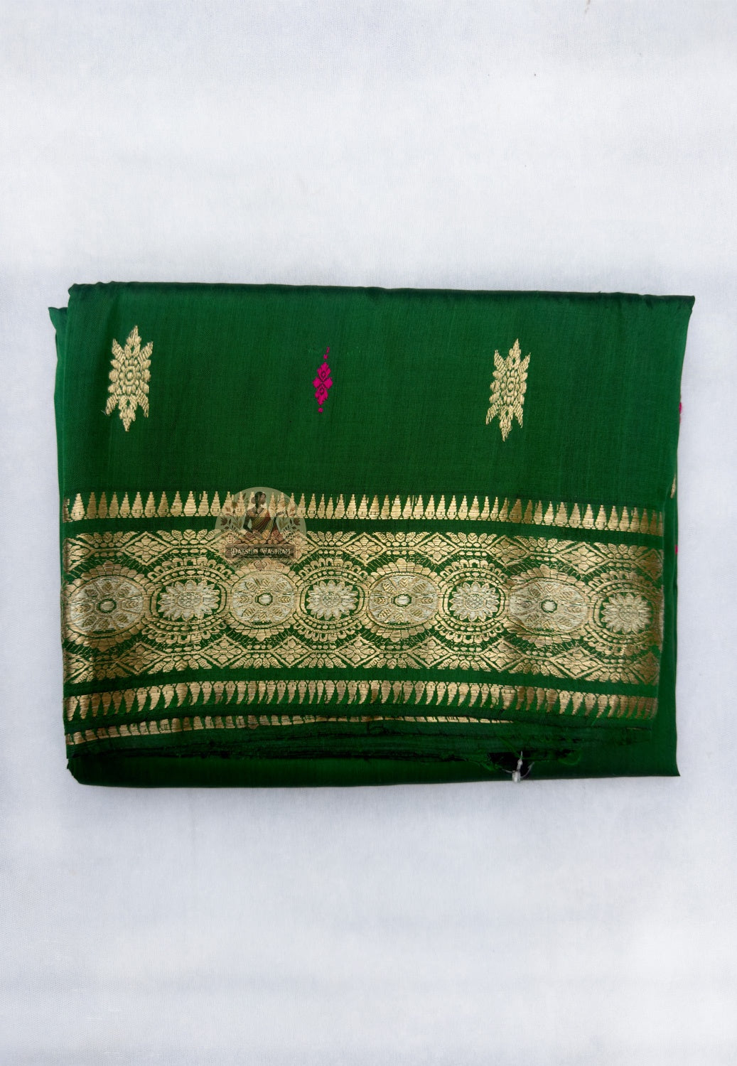 Full flat-lay of Swarnachari pure silk saree with golden zari witness border, tradition-carried pallu, endurance buti field, and matching unstitched blouse piece, West Bengal handloom