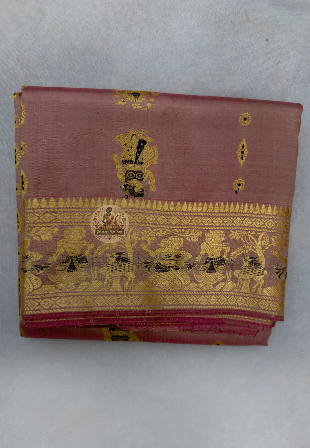 Close-up of handloom Baluchari silk saree pallu showing extra-weft woven Mahabharata narrative panel with figures and temple-art compositions built directly into pure silk, Bishnupur craft