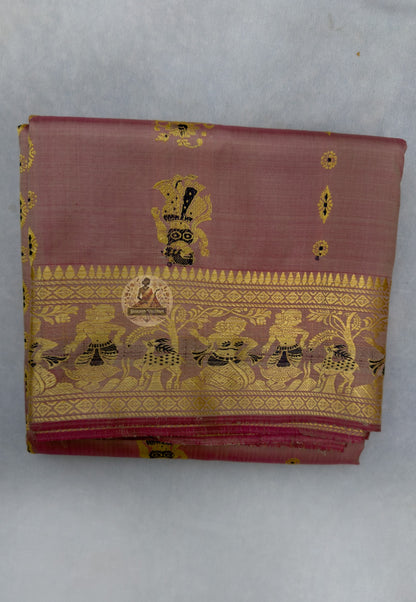 Close-up of handloom Baluchari silk saree pallu showing extra-weft woven Mahabharata narrative panel with figures and temple-art compositions built directly into pure silk, Bishnupur craft