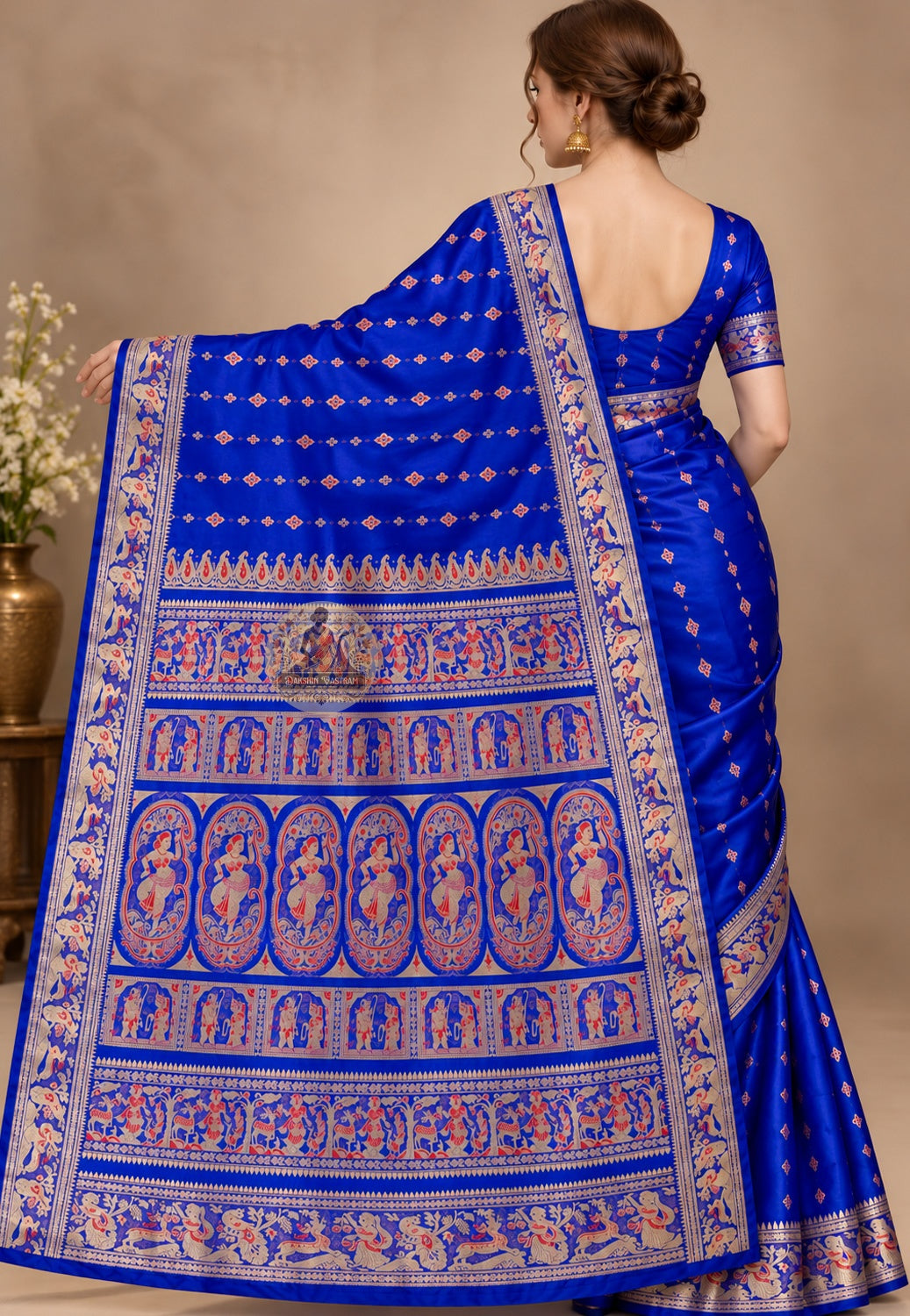 Front view of royal blue Swarnachari saree showing mythological narrative panels and golden zari weave on pure silk fabric