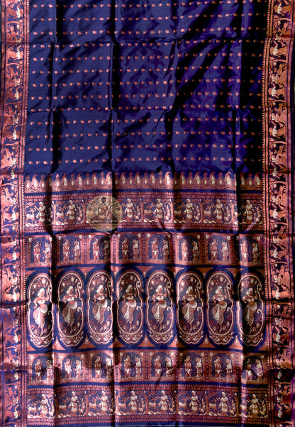 Close-up of Swarnachari silk saree pallu showing hand-woven golden zari tradition panel with Bengal temple iconography and mythological scene kept alive by West Bengal weavers