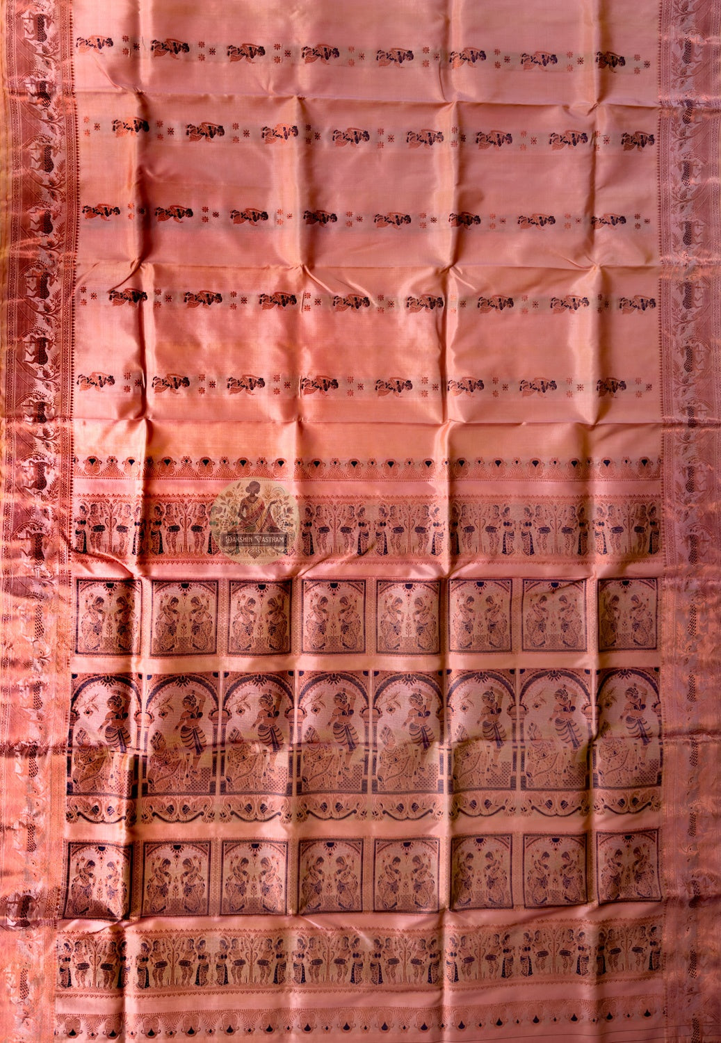 Close-up of Swarnachari silk mythology saree weave showing golden zari Mahabharata and Bishnupur terracotta temple art motifs woven thread by thread on handloom