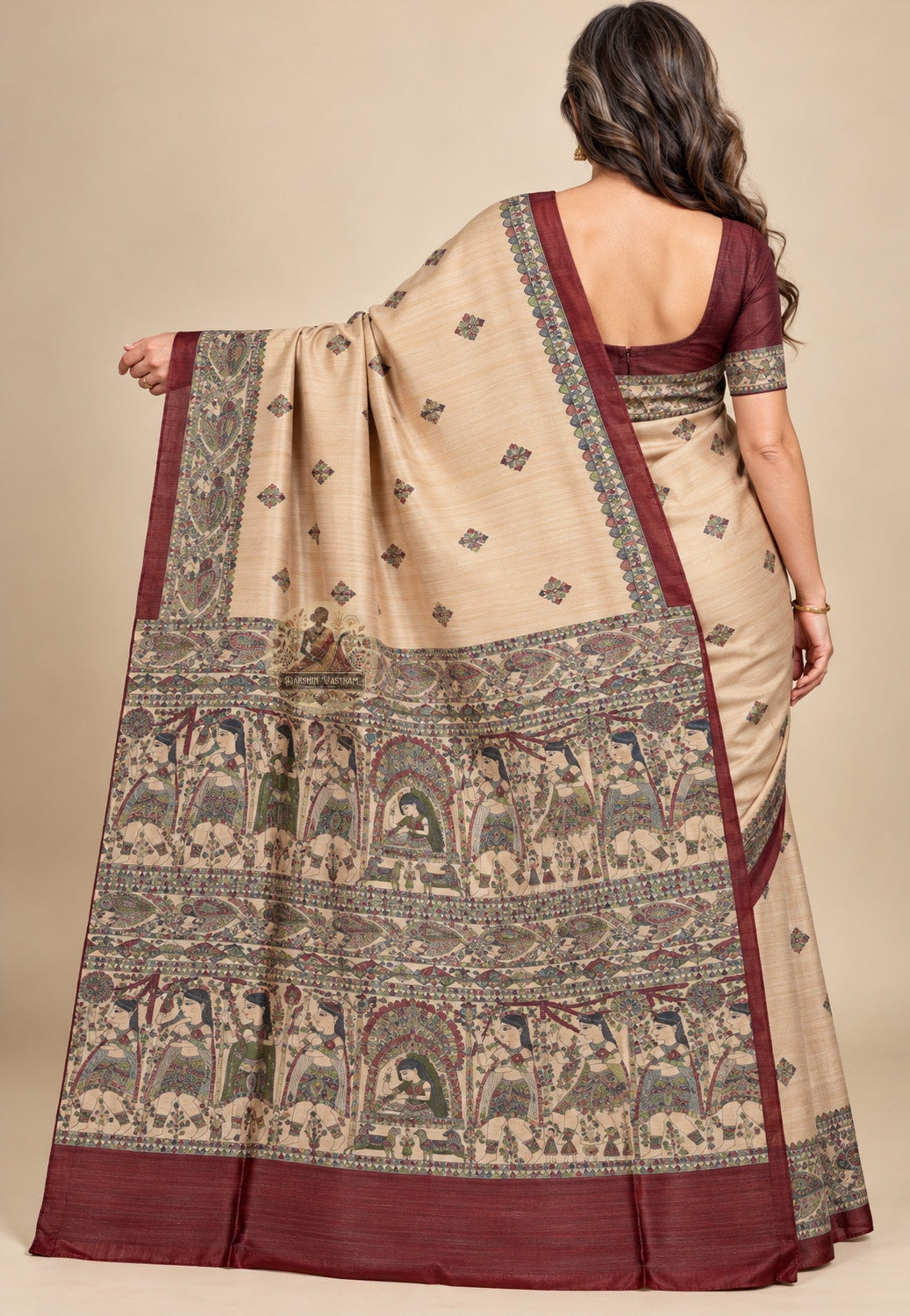 Side view of beige Ghicha Tussar silk saree showing the pleated drape and contrasting maroon edge