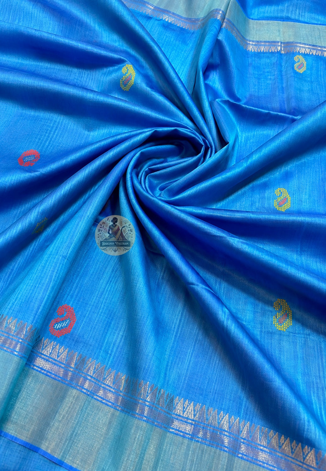 Close-up of handloom Bishnupur Katan silk saree showing tight even classical weave structure with natural lustre, practised to the standards of Bishnupur's uninterrupted silk tradition