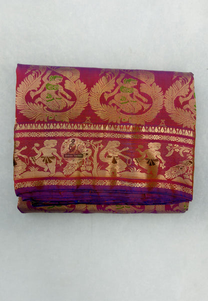 Close-up of Swarnachari handloom silk saree body showing warm pure silk ground with fine golden zari butis (small woven motifs) marking the interior territory of Bengal's craft geography across the field
