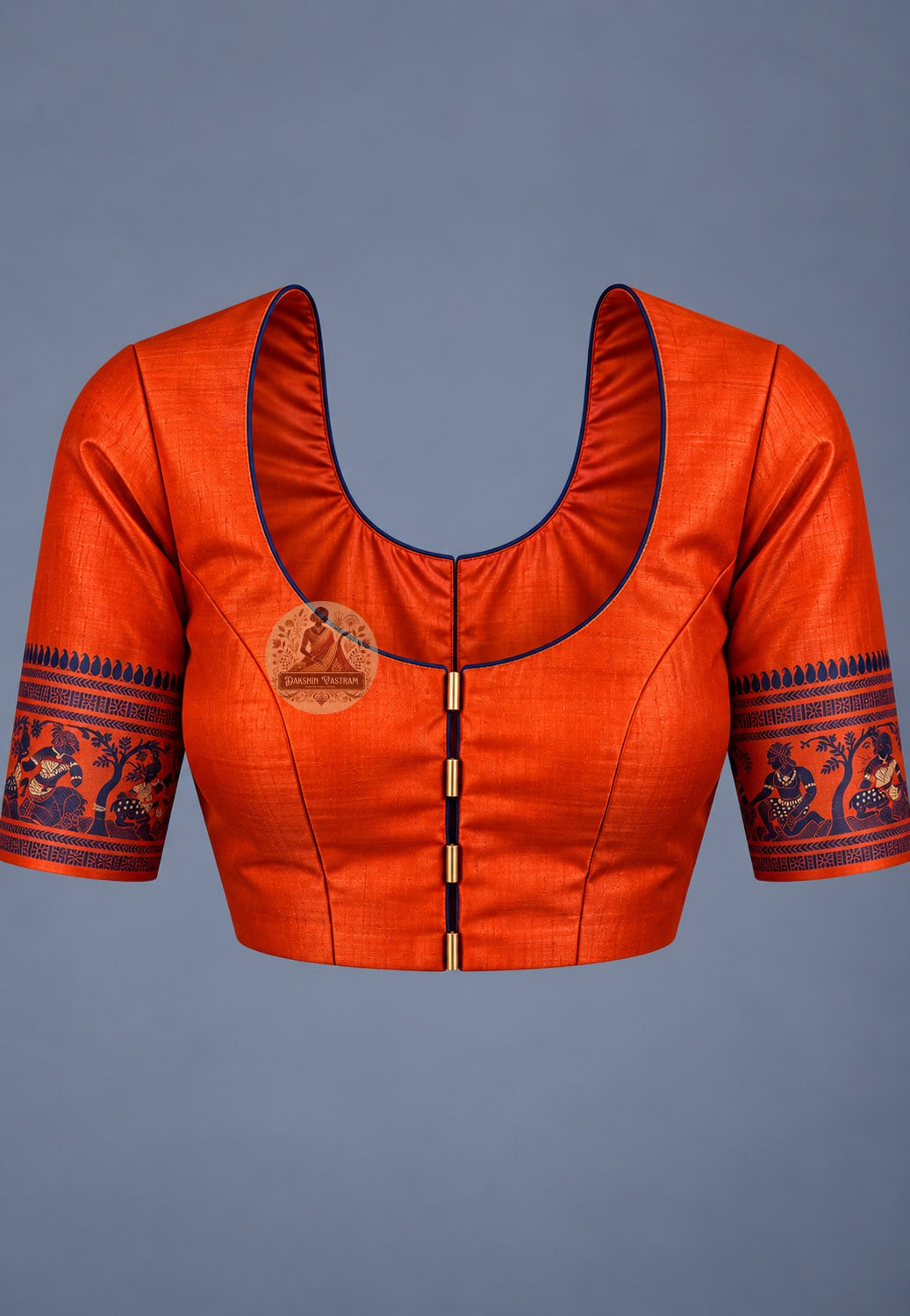 Blouse paired with orange Baluchari silk saree, featuring patterned sleeve borders
