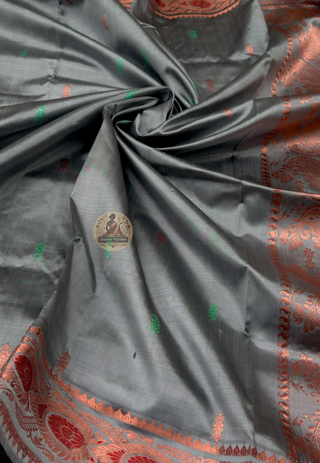 Rear view of premium Swarnachari silk saree displaying golden zari pallu with hand-woven Bengal temple and Ramayana vocabulary compositions stated with centuries of fluency