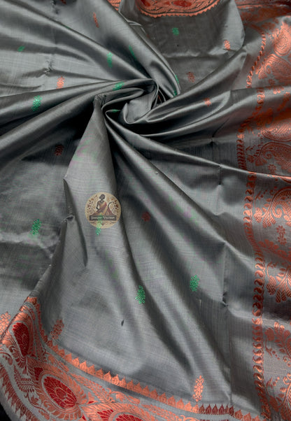 Rear view of premium Swarnachari silk saree displaying golden zari pallu with hand-woven Bengal temple and Ramayana vocabulary compositions stated with centuries of fluency