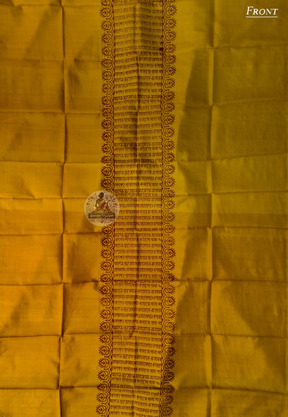 Flat lay of unstitched Baluchari Silk Kurti Piece showing swirling kalka repeat and dotted wave border full fabric length