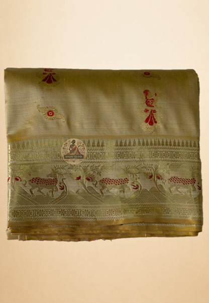 Full saree view highlighting beige gold pleats, patterned borders and red-accented figurative panels