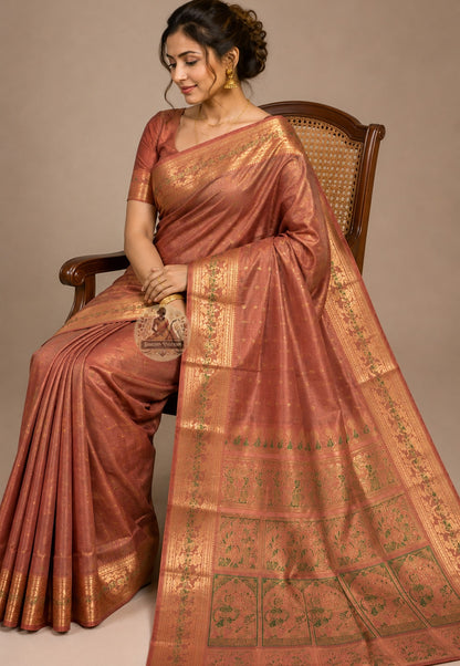 Close-up of Swarnachari handloom silk saree body showing warm pure silk ground with fine golden zari butis (small woven motifs) as quiet expressions of Bengal's craft identity